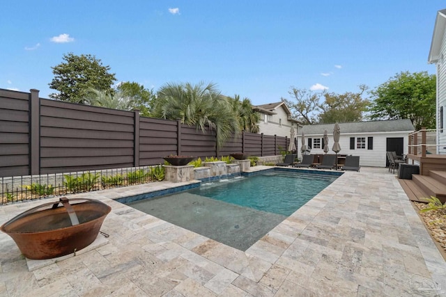 view of swimming pool with an outdoor living space, a fenced in pool, a fenced backyard, and a patio area