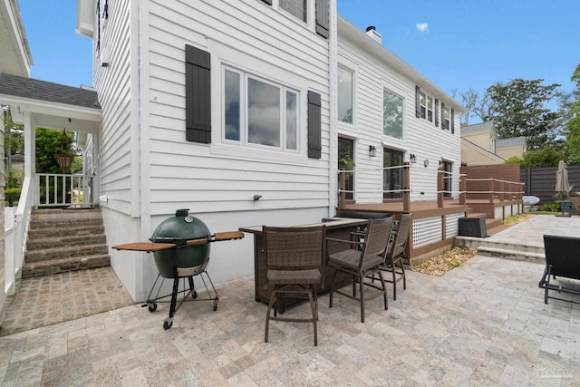 view of patio / terrace featuring fence