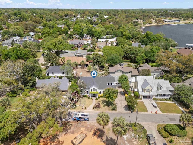 drone / aerial view featuring a residential view and a water view