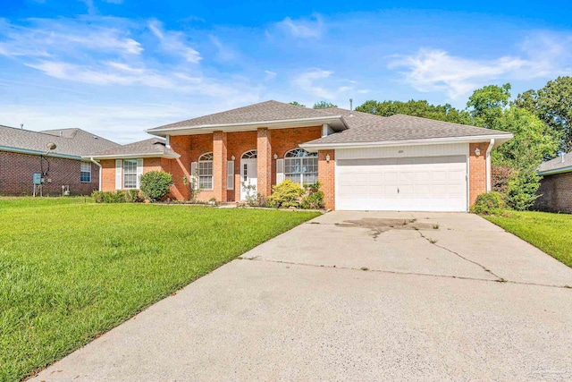 ranch-style house with a garage and a front lawn