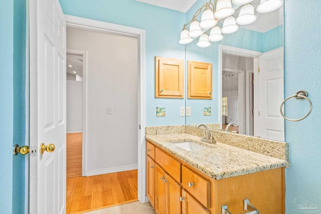 bathroom with vanity and hardwood / wood-style floors