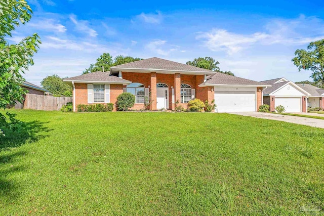 view of front of house with a garage and a front lawn