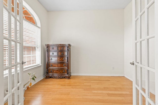 interior space with light hardwood / wood-style floors and french doors