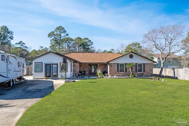 ranch-style house featuring a front lawn