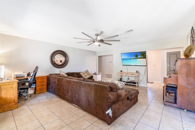 living room with ceiling fan and light tile patterned flooring