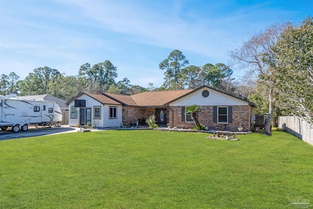 ranch-style home with a front lawn