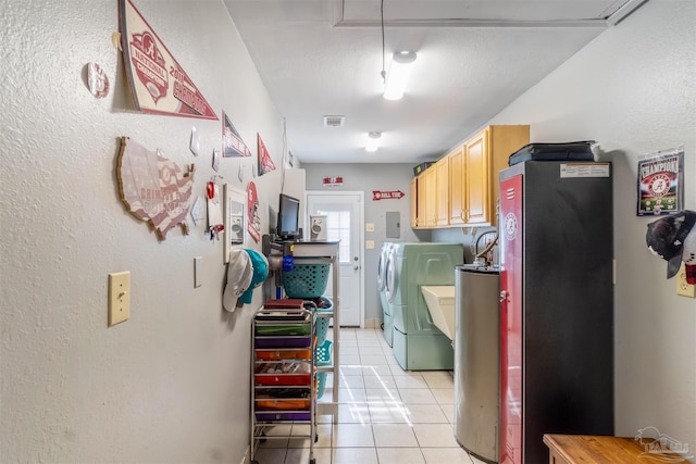 clothes washing area featuring light tile patterned flooring, electric panel, and independent washer and dryer