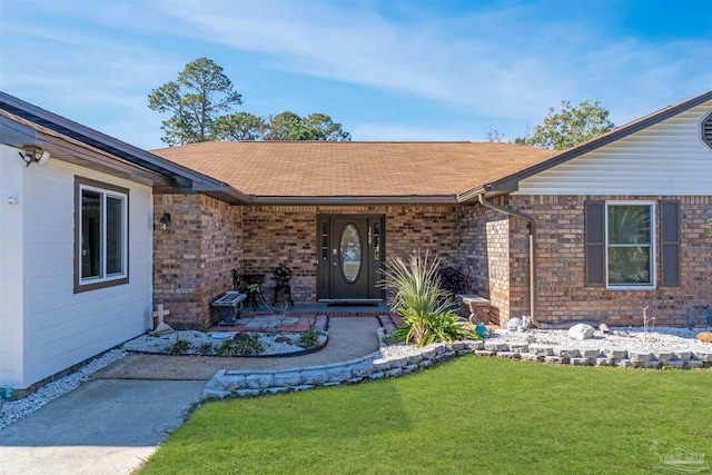 entrance to property with a yard