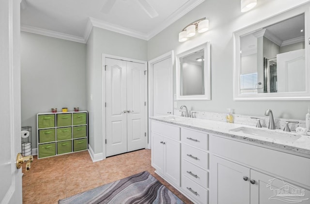 bathroom featuring vanity, crown molding, and tile patterned flooring