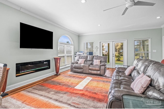 living room featuring french doors, ornamental molding, hardwood / wood-style flooring, and ceiling fan