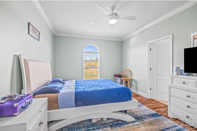 bedroom with dark wood-type flooring, crown molding, a textured ceiling, and ceiling fan