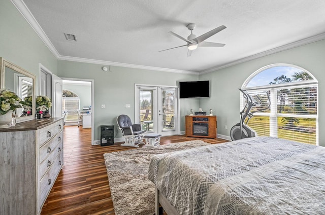 bedroom featuring ceiling fan, access to outside, a textured ceiling, ornamental molding, and dark hardwood / wood-style floors