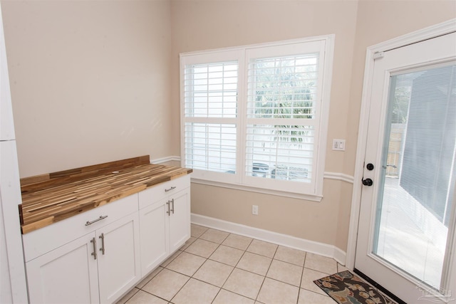 entryway featuring light tile patterned floors