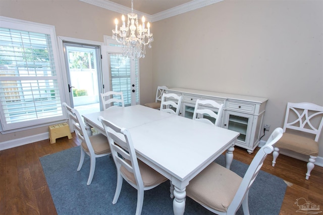 dining space with crown molding, dark wood-type flooring, and a chandelier