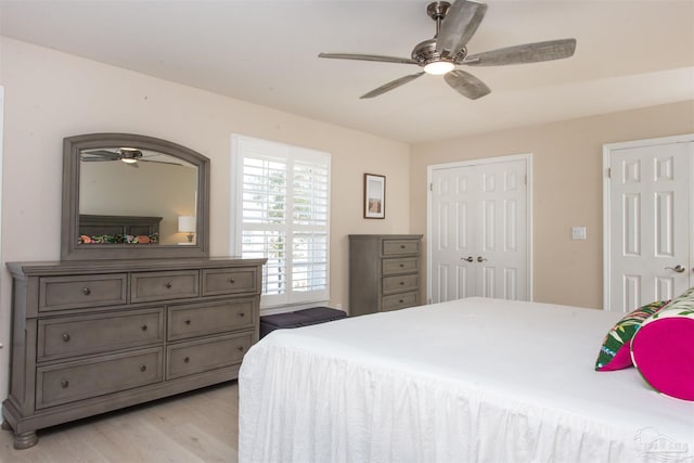 bedroom with ceiling fan and light wood-type flooring