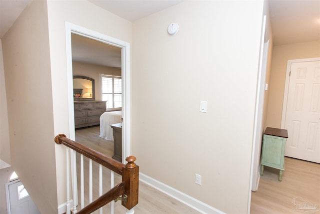 hall with light hardwood / wood-style floors