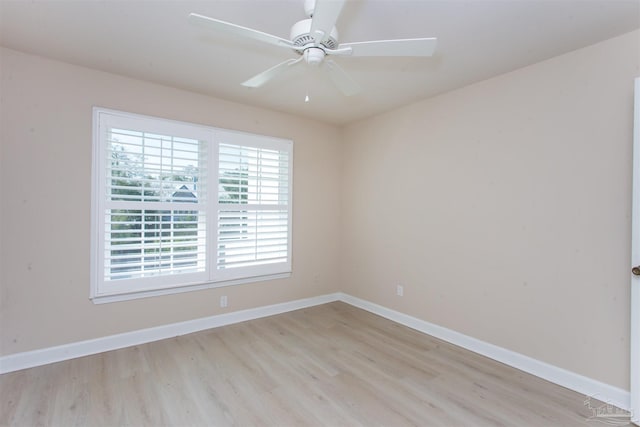 spare room with ceiling fan and light hardwood / wood-style floors