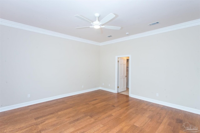 unfurnished room featuring ornamental molding, hardwood / wood-style floors, and ceiling fan