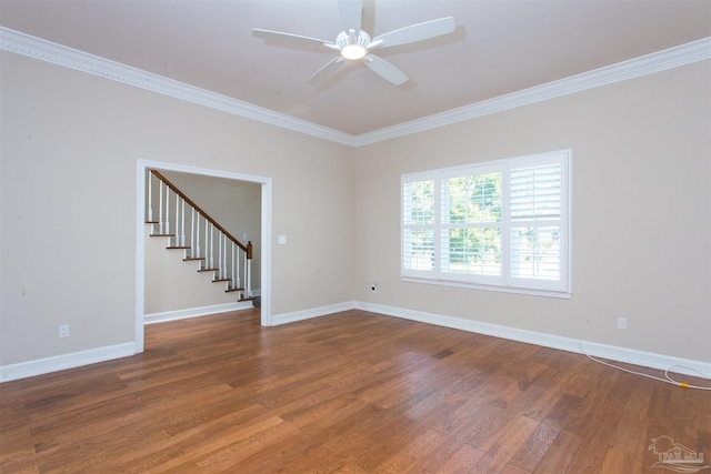 empty room featuring wood-type flooring, ornamental molding, and ceiling fan