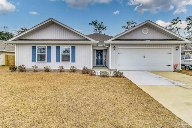 ranch-style house featuring a garage and a front yard