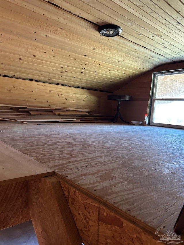 bonus room with wooden ceiling and vaulted ceiling