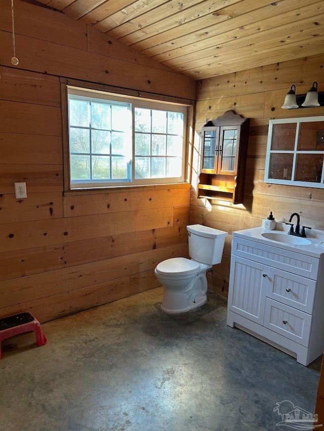 bathroom featuring wooden walls, vaulted ceiling, toilet, concrete floors, and wood ceiling