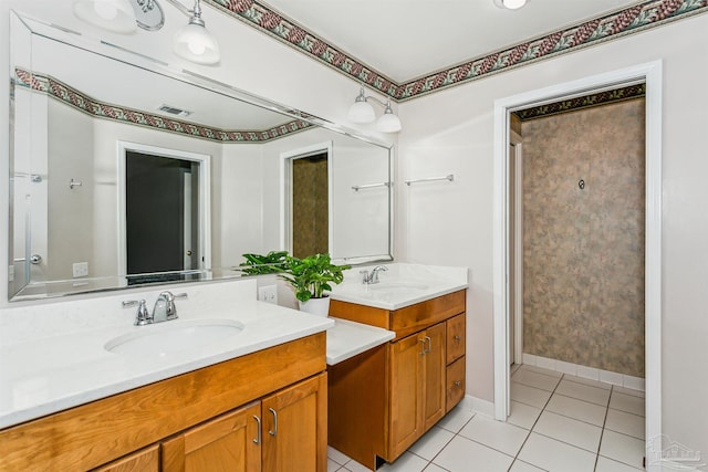 full bath with tile patterned floors, visible vents, two vanities, and a sink