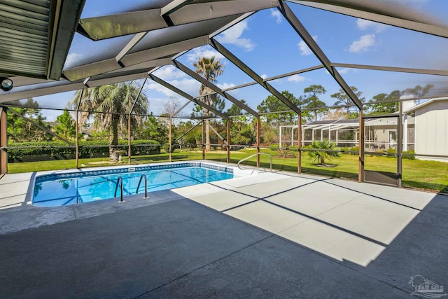 pool featuring a yard, a patio, and glass enclosure