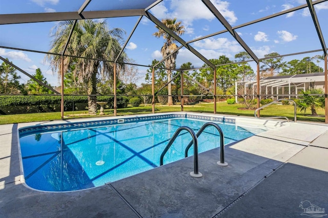 pool featuring a patio area, glass enclosure, and a yard