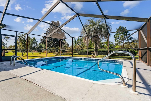 pool featuring a lanai, a yard, and a patio area