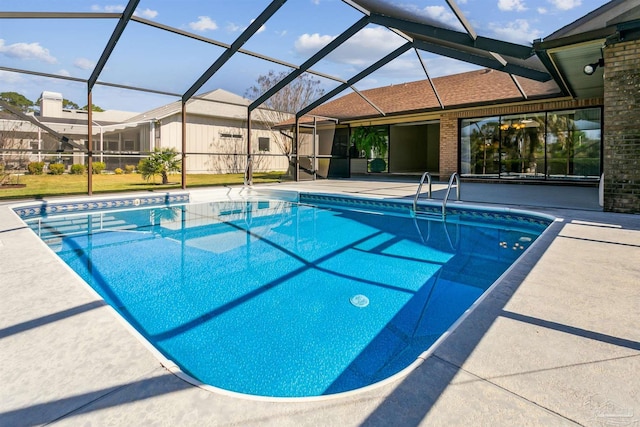 pool featuring a patio area and glass enclosure