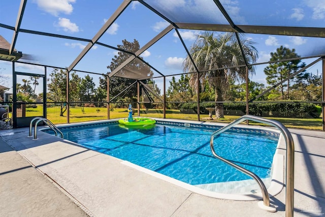 outdoor pool with a patio, a yard, and a lanai