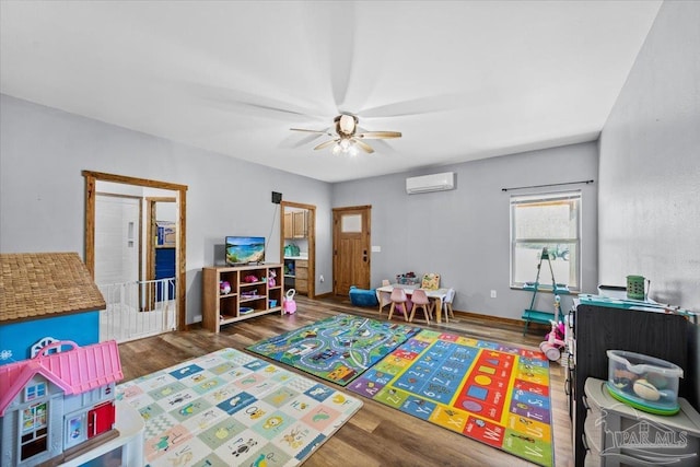 3351 Velor Rd, Mcdavid, FL 32568 - playroom with wood finished floors, an AC wall unit, and a ceiling fan