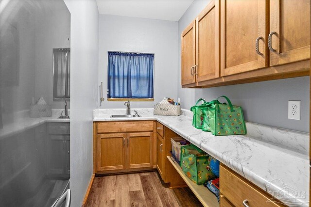 3351 Velor Rd, Mcdavid, FL 32568 - laundry room featuring a sink and wood finished floors