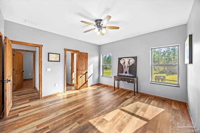 3351 Velor Rd, Mcdavid, FL 32568 - unfurnished bedroom featuring baseboards, ceiling fan, visible vents, and light wood finished floors