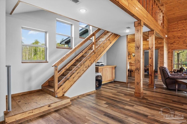 3351 Velor Rd, Mcdavid, FL 32568 - interior space with visible vents, wooden walls, baseboards, wood finished floors, and lofted ceiling