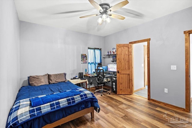 3351 Velor Rd, Mcdavid, FL 32568 - bedroom featuring baseboards, wood finished floors, and a ceiling fan