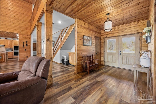 3351 Velor Rd, Mcdavid, FL 32568 - entryway with dark wood finished floors, wooden ceiling, wood walls, and stairway