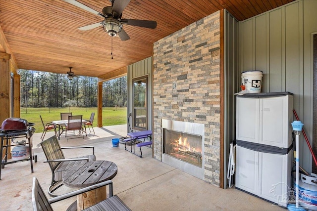 3351 Velor Rd, Mcdavid, FL 32568 - view of patio / terrace with a ceiling fan, outdoor dining area, an outdoor stone fireplace, and grilling area