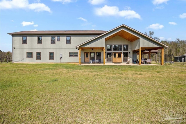 3351 Velor Rd, Mcdavid, FL 32568 - rear view of property featuring ceiling fan, a yard, and a patio area