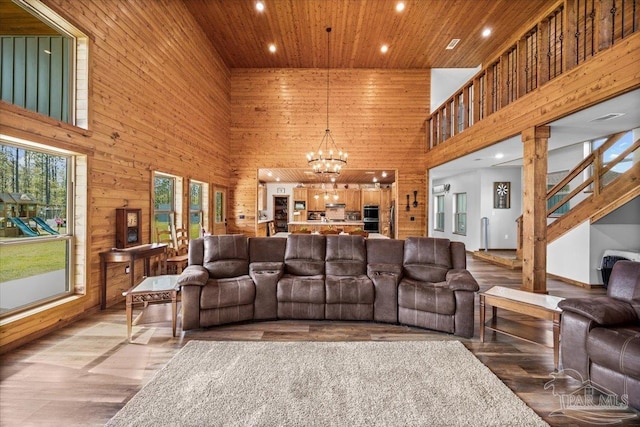 3351 Velor Rd, Mcdavid, FL 32568 - living area featuring recessed lighting, wooden ceiling, wooden walls, light wood-style flooring, and a notable chandelier