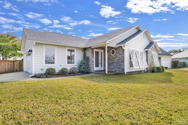 single story home with a garage and a front lawn