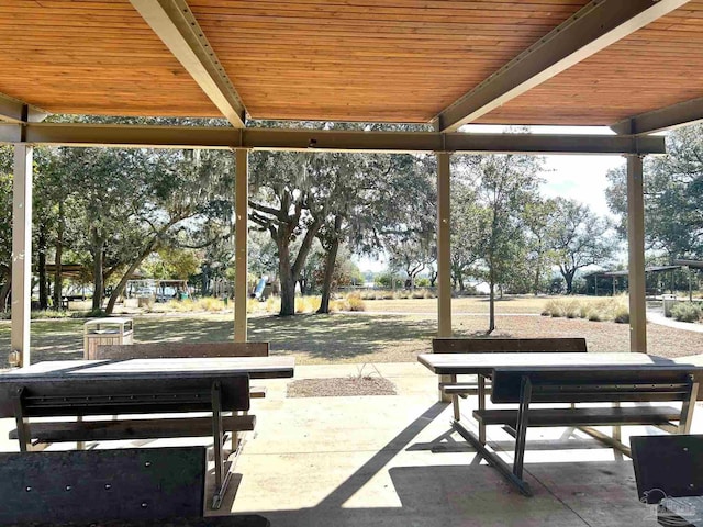 view of property's community with a patio area