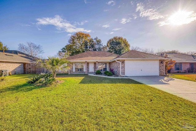 ranch-style house featuring a front yard and a garage