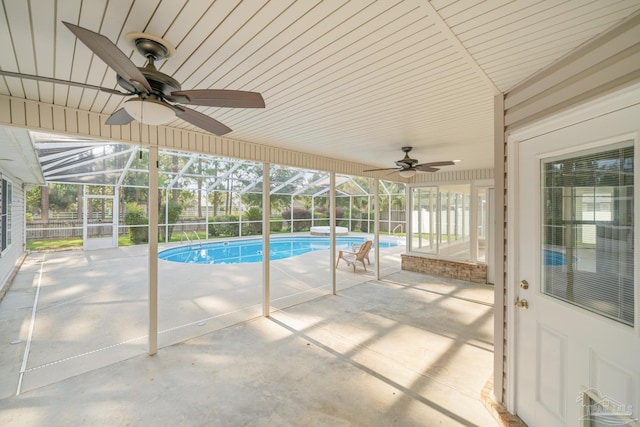 view of swimming pool with a lanai, a patio, and ceiling fan