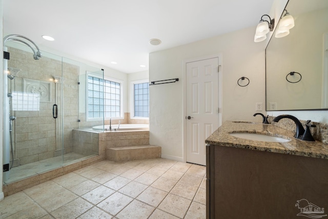 bathroom with tile patterned flooring, vanity, and separate shower and tub