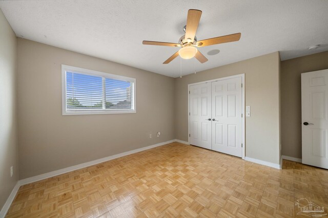 empty room featuring light parquet floors and ceiling fan