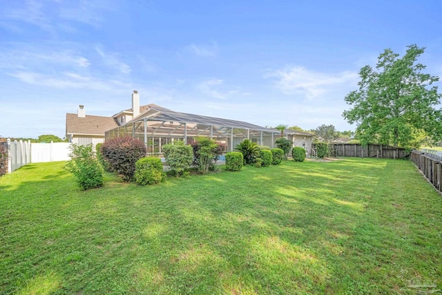 view of yard featuring a lanai