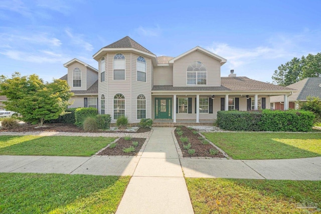 view of front facade featuring a front lawn and a porch