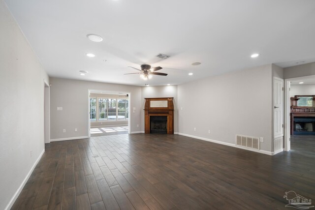 unfurnished living room with ceiling fan and dark hardwood / wood-style floors